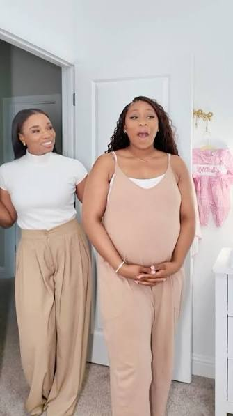 Chioma with an expecting mother in her baby's nursery