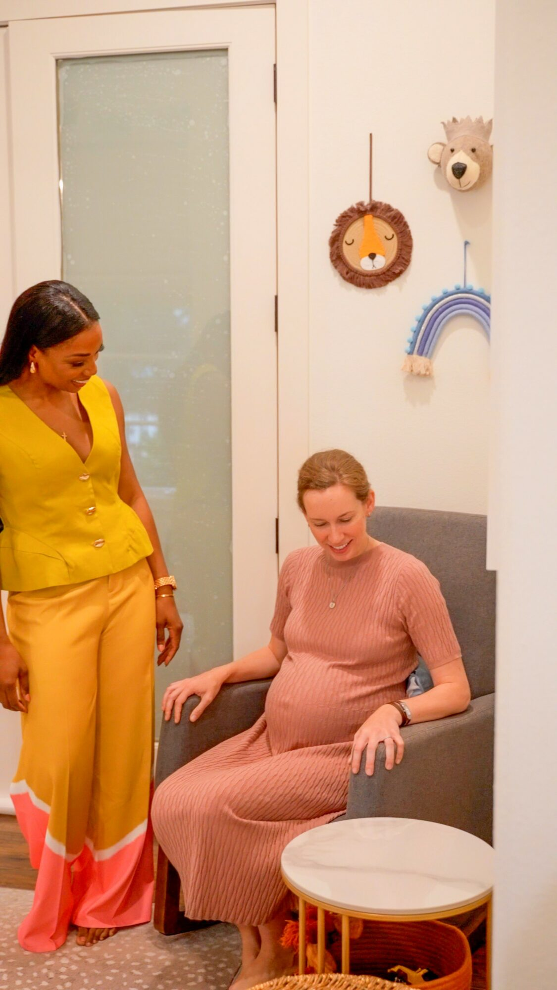 Chioma with an expecting mother in a finished nursery by Chi's Nest